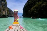 Ko Phi Phi consists of two islands, Phi Phi Leh and Phi Phi Don, located southeast of Phuket. Both are part of Hat Noppharat Thara Ko Phi Phi National Marine Park.<br/><br/>

Set in the centre of the Sea of Phuket, Ko Phi Phi is almost equidistant from Phuket and Krabi and can be reached by boat in around two hours.<br/><br/>

Phi Phi Don is the larger of the two islands, with scenic hills, steep cliffs, silken beaches, azure waters and remarkable bird- and sea-life. The island narrows at the middle where long, white-sand beaches are only a few hundred metres apart. Boats from Krabi and Phuket dock at Ao Ton Sai on the southern side of the island. Hat Yao or 'Long Beach' faces south and is famous for the good snorkelling to be had on its coral reefs. To the northeast Hat Lanti is another fine beach with good waves for surfing. North of this beach is beautiful Ao Bakao, a bay with a small resort, while near the tip of Laem Tong are three more luxury resorts.